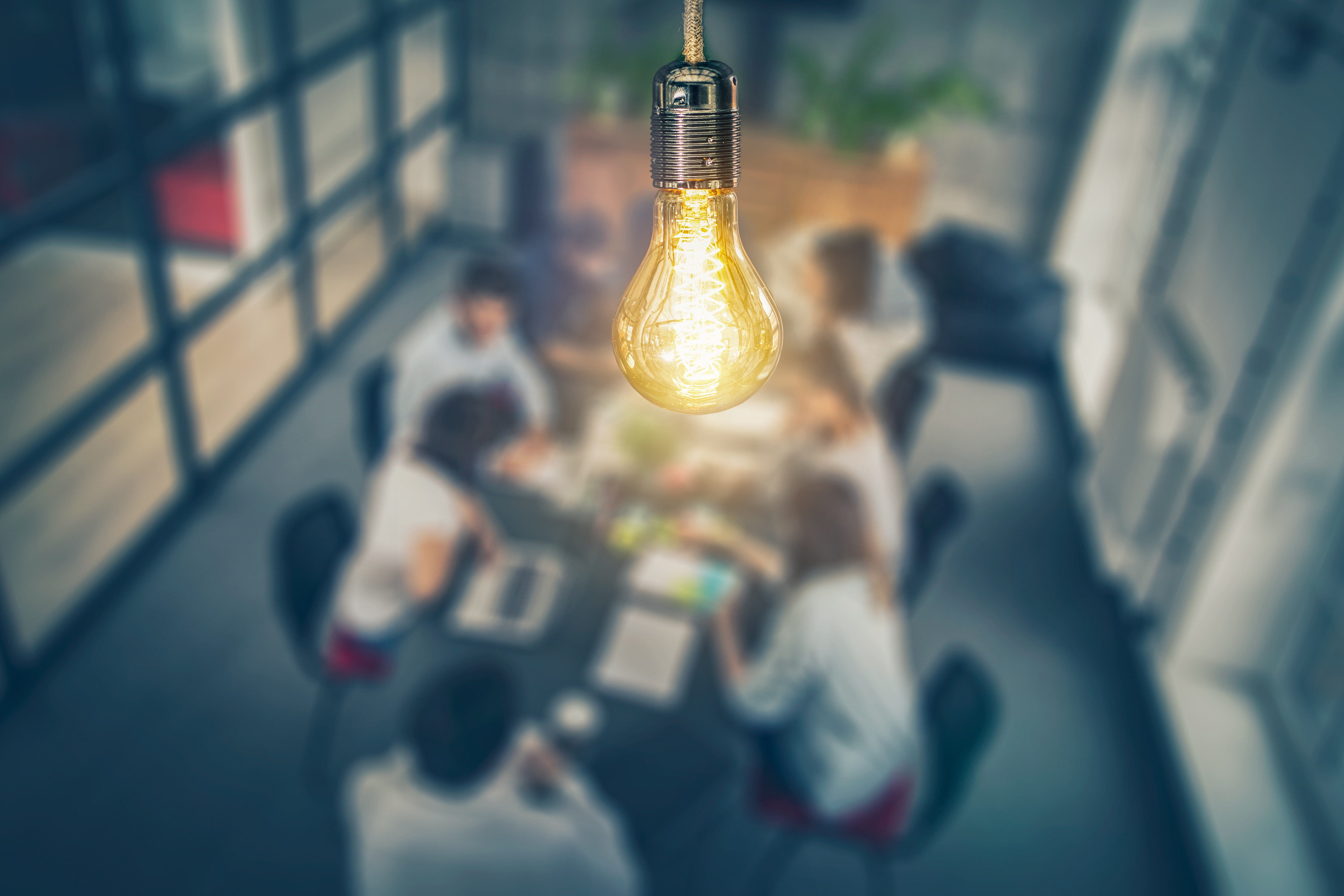 conference room with a bright lightbulb overhead 