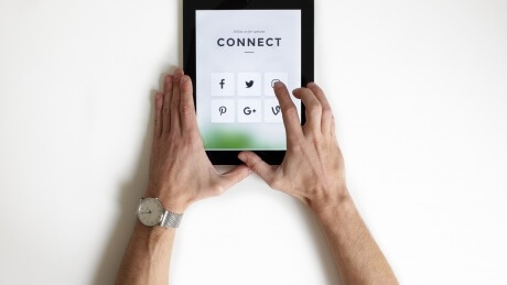 ipad showing the word "connect" with social network icons 