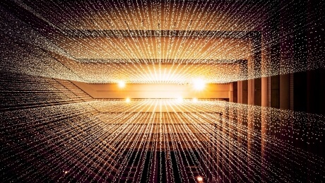 Long lines of tiny speckles on light in a high-ceiling interior