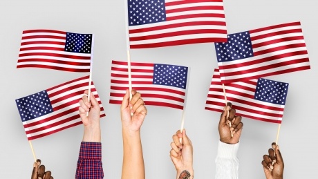 6 small American flags waving 