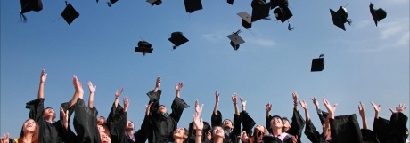 Graduates throwing caps